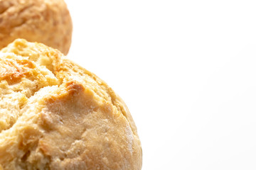 Assortment, different kinds of wheat baked bread with golden crust on white background with copy space, bakery and grocery concept
