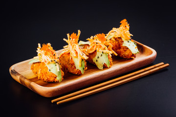 Japanese food, salmon croquettes on a black background
