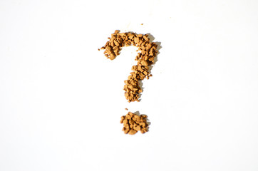 Granulated instant coffee  in a shape of question mark on a white background,photo