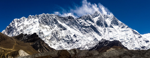 Front view of south face wall of Lhotze and Nuptse mountain in Nepal. Himalayas.  8516 meters above the sea. Covered by clouds. 