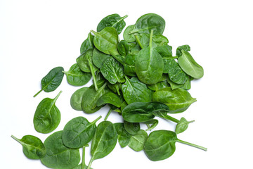 Fresh spinach leaves on white isolated background. The concept of healthy food and vegetarianism