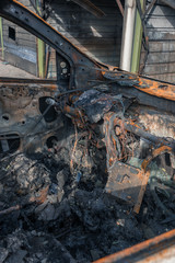 Interior of a completely burned car in the suburbs