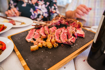 Family enjoy beef and wine good on a holiday
