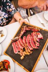 Family enjoy beef and wine good on a holiday