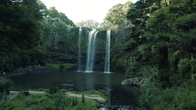 Whangarei Waterfalls aerial drone footage flying through trees 4k dramatic  footage in New Zealand
