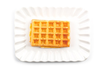 Belgium waffer on ceramic plate isolated on white background.