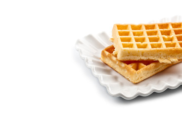Belgium waffers on white ceramic plate isolated on white background.