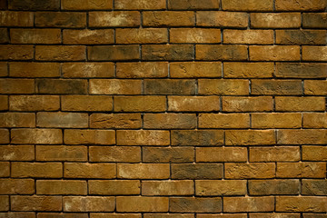 old yellow and brown brick wall, texture pattern, background