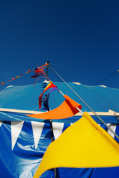 Colored Pennants In A Blue Circus Tent