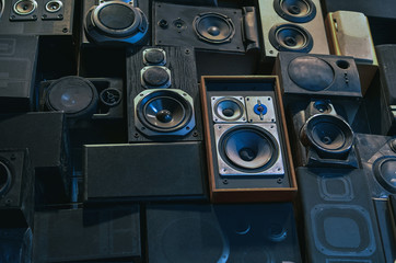 Wall of vintage loudspeakers. Creative music background. 