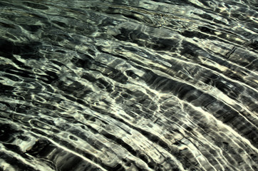Fototapeta na wymiar Caumasee; ripples on the waters of the Grisons' famous lake, Swiss Alps