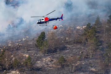 Helicopter extinguishing wildfire. Bergen, Norway.