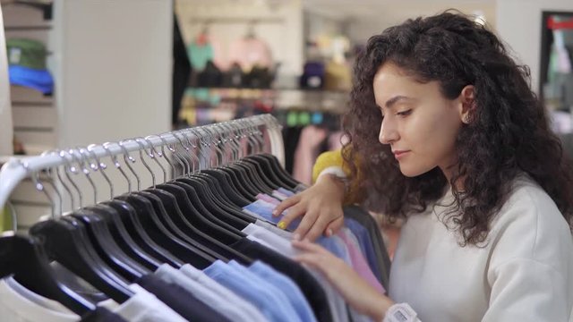 Pretty brunnete shopping for clothes.
