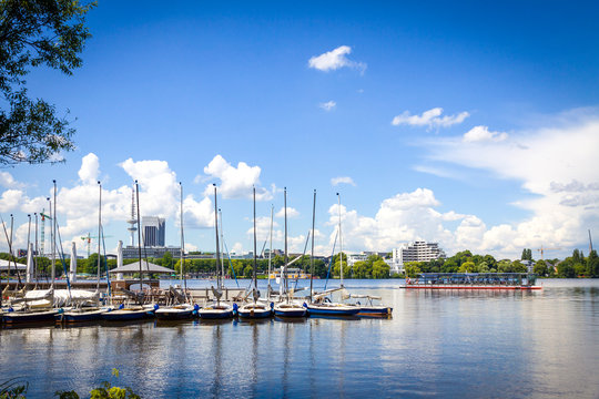 Waterfront of Aussenalster Lake in Hamburg city, Germany. Lake and its shores are used by Hamburg inhabitants for many sport and recreational purposes, such as sailing and rowing
