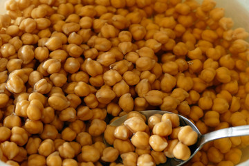 boiled chickpeas in a spoon, close-up