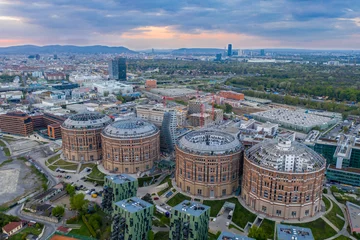 Poster Beautiful drone shot of Viennas Gasometer buidlings from up above © Marko