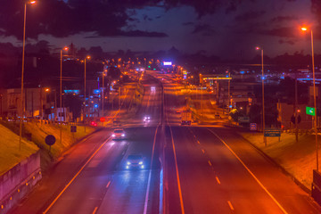 Night busy traffic on the highway ,light trace from the cars