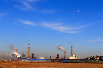 A chemical plant against a blue sky