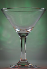 Martini Glass with flashing bright green lights on background