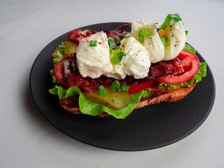 Toast with bacon, tomato ,pickle and boiled eggs