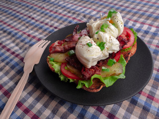 Toast with bacon, tomato ,pickle and boiled eggs