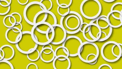 Abstract illustration of randomly arranged white rings with soft shadows on yellow background