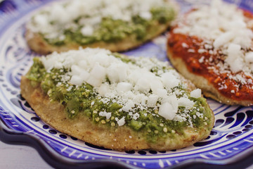 mexican tlacoyos with green and red sauce, Traditional food in Mexico