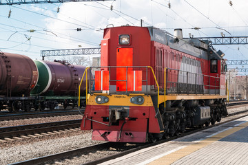 Diesel-electric shunting locomotive running alone on rails