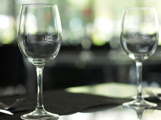 Close-up of empty wine glasses on a table at a restaurant