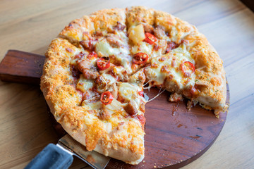 Pizza on a wooden tray