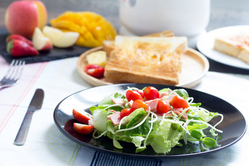 Breakfast, toast and vegetable salad with fruit