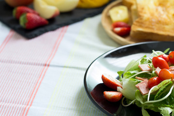 Breakfast, toast and vegetable salad with fruit