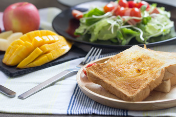 Breakfast, toast and vegetable salad with fruit