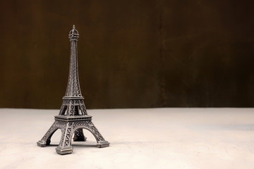 Eiffel Tower Souvenir on Concrete Ground.