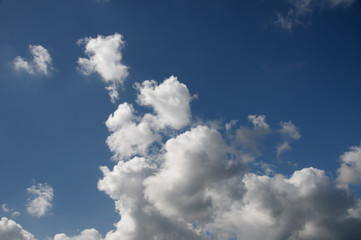 Magnificent white cumulonimbus cloud in blue sky. Australia.