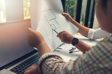 Engineer and Architect concept, Engineer Architects office team working with blueprints