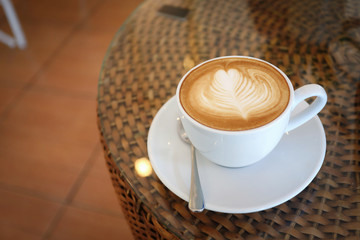 hot latte coffee drink put on table in cafe restaurant
