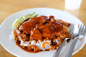 Barbecued red pork in sauce with rice