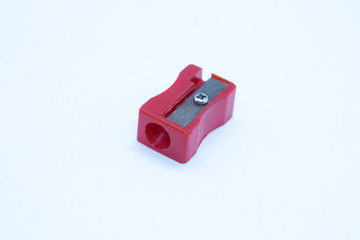 Red pencil sharpener isolated on white background.