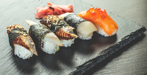 sushi set on black stone board