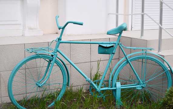 Old bike painted with green paint. Retro bike. Day of the bike. Decorative bike. The concept of an active lifestyle.
