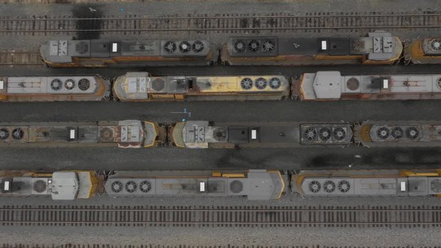 Aerial Footage of Train Locomotive Engines from Drone Looking Down Trainyard
