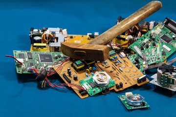 old electronic board and hammer