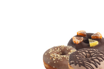 Different bright tasty donuts on a white background. Place under the text. Diversity.