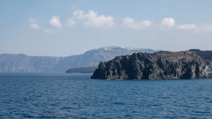 Fototapeta premium the village of thira on santorini as seen from a ferry boat