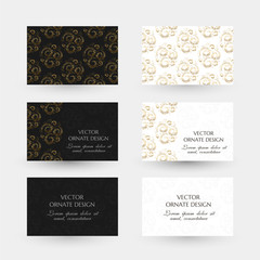 Fototapeta na wymiar Golden swirls design. Business cards with decorative elements on the black and white background.