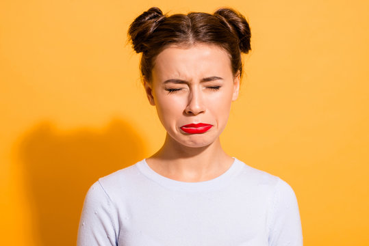 Close-up portrait of her she nice-looking attractive lovely winsome offended teen girl closed eyes grief dislike disgust isolated over bright vivid shine yellow background