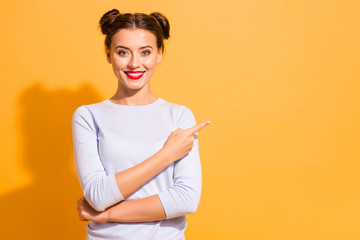 Portrait of magnificent attractive youngster telling way wearing white jumper isolated on vibrant...