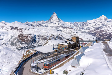 Matterhorn peak and Gornergrat railway station on top hill, Zermatt, Switzerland. - 263387983