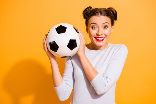 Close up photo pretty amazing hairdo she her lady hold hands arms leather ball advising buy buyer captain cheerleader pray for win favorite team wear casual white pullover isolated yellow background